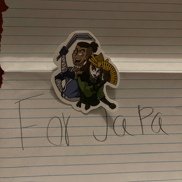 A sticker with Avatar: The Last Airbender characters Sokka and Suki with a letter reading “For JaPa” which is what my kids call me instead of papa.