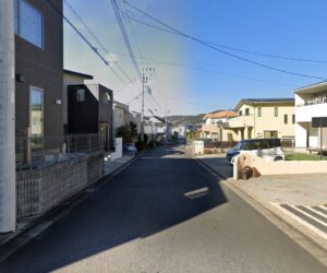 Typical view of the last street in Japan I lived on in Hiratsuka, Japan, an exurban part of Greater Tokyo/Yokohama. A residential street with modern houses, a clear sky, and overhead power lines. A car is covered with a white sheet on the right. 
